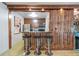 Bar kitchen featuring dark wood cabinets, steel stools, and sleek countertops at 1150 Collier Nw Rd # K18, Atlanta, GA 30318