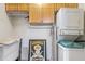 Laundry room with storage cabinets, and stacked washer and dryer at 1150 Collier Nw Rd # K18, Atlanta, GA 30318