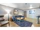 Comfortable living room with hardwood floors, plush seating, and a stylish accent wall at 1150 Collier Nw Rd # K18, Atlanta, GA 30318