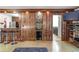 Open-concept living space with bar area, dark wood details, and sleek bar stools at 1150 Collier Nw Rd # K18, Atlanta, GA 30318