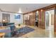 Cozy living room featuring a wet bar with wood accents, plush seating, and hardwood floors at 1150 Collier Nw Rd # K18, Atlanta, GA 30318