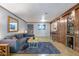 Living room showcases a bar area, wood-look floors, and modern furniture at 1150 Collier Nw Rd # K18, Atlanta, GA 30318
