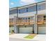 Exterior view of the back of the townhomes showing the garages and elevated decks at 1262 Ainsworth Aly # 48, Sugar Hill, GA 30518