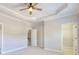 Bright bedroom with a ceiling fan and access to a walk-in closet at 2919 Camplay Dr, Suwanee, GA 30024