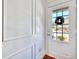 Bright entryway with white wainscoting and a front door with decorative star wreath at 2919 Camplay Dr, Suwanee, GA 30024