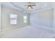 Large main bedroom with a ceiling fan and natural light at 2919 Camplay Dr, Suwanee, GA 30024