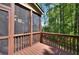 Relaxing screened-in porch with views of the surrounding trees and nature at 2919 Camplay Dr, Suwanee, GA 30024