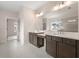 Bright bathroom boasts a double sink vanity and a large mirror with great lighting at 3390 Hillshire Dr, Cumming, GA 30028