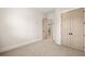 Bedroom with closet, door, and neutral walls providing a serene and adaptable space at 3390 Hillshire Dr, Cumming, GA 30028