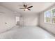 Neutral bedroom boasts natural light, adjacent doors for bathroom and hallway access at 3390 Hillshire Dr, Cumming, GA 30028