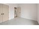 Bedroom featuring a door, closet, neutral walls and trim ready for your personal touch at 3390 Hillshire Dr, Cumming, GA 30028