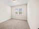 Bedroom with carpeted floors and a window offering natural light at 3390 Hillshire Dr, Cumming, GA 30028
