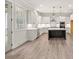 Modern kitchen with white cabinetry, a center island, and stainless steel appliances at 3390 Hillshire Dr, Cumming, GA 30028