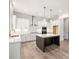 Bright kitchen with an island, stainless steel appliances, and white cabinetry at 3390 Hillshire Dr, Cumming, GA 30028