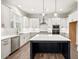 Stylish kitchen featuring custom cabinets, quartz countertops, and an island at 3390 Hillshire Dr, Cumming, GA 30028