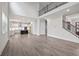 Open-concept living room showing the staircase and the kitchen beyond at 3390 Hillshire Dr, Cumming, GA 30028