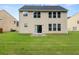 Large backyard with a patio and a sliding door to the house at 145 Redsage Rdg, Atlanta, GA 30349