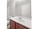 Bathroom featuring a toilet, white sink, and mirror at 145 Redsage Rdg, Atlanta, GA 30349