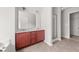 Bathroom vanity with a large mirror and a glass-enclosed shower at 145 Redsage Rdg, Atlanta, GA 30349