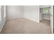 Bedroom featuring neutral carpet, natural light, and walk-in closet at 145 Redsage Rdg, Atlanta, GA 30349