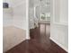 Inviting entryway featuring dark hardwood floors, carpeted dining room and a view into the living area at 145 Redsage Rdg, Atlanta, GA 30349