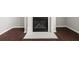 Close up of the fireplace with white mantel, carpet and dark hardwood floors at 145 Redsage Rdg, Atlanta, GA 30349