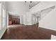 Open-concept living area with hardwood floors, high ceilings, and abundant natural light at 145 Redsage Rdg, Atlanta, GA 30349