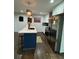 Kitchen island features stainless steel appliances, pendant lighting, and quartz countertop at 2874 Cloverleaf Se Dr, Atlanta, GA 30316
