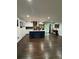 Open kitchen featuring a blue island, stainless steel appliances, and modern lighting at 2874 Cloverleaf Se Dr, Atlanta, GA 30316