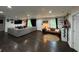 Spacious living room featuring hardwood floors, sectional sofa and abundant natural light at 2874 Cloverleaf Se Dr, Atlanta, GA 30316
