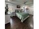 Bright main bedroom with a ceiling fan, an area rug, and a large bed at 2874 Cloverleaf Se Dr, Atlanta, GA 30316