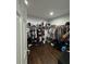 Walk-in closet with built-in shelving and hanging racks for storage at 2874 Cloverleaf Se Dr, Atlanta, GA 30316