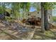 Spacious backyard featuring a deck, fire pit and stairs leading to another area at 4540 Saddle Se Ct, Smyrna, GA 30082
