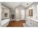 Bright bathroom featuring a soaking tub, separate shower, and vanity with double sinks at 4540 Saddle Se Ct, Smyrna, GA 30082
