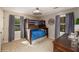 Bedroom with bunk beds, a desk, two windows, and light gray curtains at 4540 Saddle Se Ct, Smyrna, GA 30082