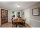 Charming dining area featuring a round table, natural light, and easy access to the outdoors at 4540 Saddle Se Ct, Smyrna, GA 30082