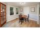 Charming dining area featuring a round table, natural light, and easy access to the outdoors at 4540 Saddle Se Ct, Smyrna, GA 30082