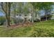 Charming two-story home with a well-manicured lawn, shuttered windows and mature trees at 4540 Saddle Se Ct, Smyrna, GA 30082