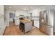 Updated kitchen with white cabinets, stainless steel appliances, and a convenient center island with seating at 4540 Saddle Se Ct, Smyrna, GA 30082