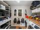 Functional laundry room with ample shelving, counter space, and modern washer and dryer at 4540 Saddle Se Ct, Smyrna, GA 30082