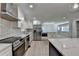 Well-equipped kitchen with stainless steel appliances, custom countertops and plenty of counter space at 780 N Ola Rd, Mcdonough, GA 30252