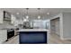 Modern kitchen with stainless steel appliances, stylish island and white cabinets with custom backsplash at 780 N Ola Rd, Mcdonough, GA 30252