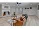 Bright living room with a white painted brick fireplace, modern furniture and light hardwood flooring at 780 N Ola Rd, Mcdonough, GA 30252