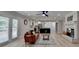 Spacious living area showcasing an open floorplan with a stylish fireplace and a modern kitchen at 780 N Ola Rd, Mcdonough, GA 30252