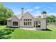 Beautiful backyard view of the home with a patio and well-maintained lawn at 001 Knob Creek Ct, Acworth, GA 30101
