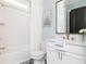 Fresh bathroom with white subway tiles and brass fixtures at 001 Knob Creek Ct, Acworth, GA 30101