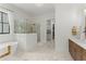 Bright bathroom with a soaking tub, walk-in shower, and marble floors at 001 Knob Creek Ct, Acworth, GA 30101