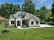 Beautiful home with brick and white siding, green lawn, and professionally landscaped yard at 001 Knob Creek Ct, Acworth, GA 30101