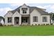 A charming home featuring a well-manicured lawn, brick accents and professionally landscaped yard at 001 Knob Creek Ct, Acworth, GA 30101
