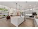 Open concept kitchen with large island, modern appliances, and a view into the living room at 001 Knob Creek Ct, Acworth, GA 30101